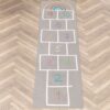 Spielmatte Teppich Läufer Hüpfspiel Hüpfkästchen Spielteppich abwaschbar Spring Kreuz Grau / Bunt 67x240cm